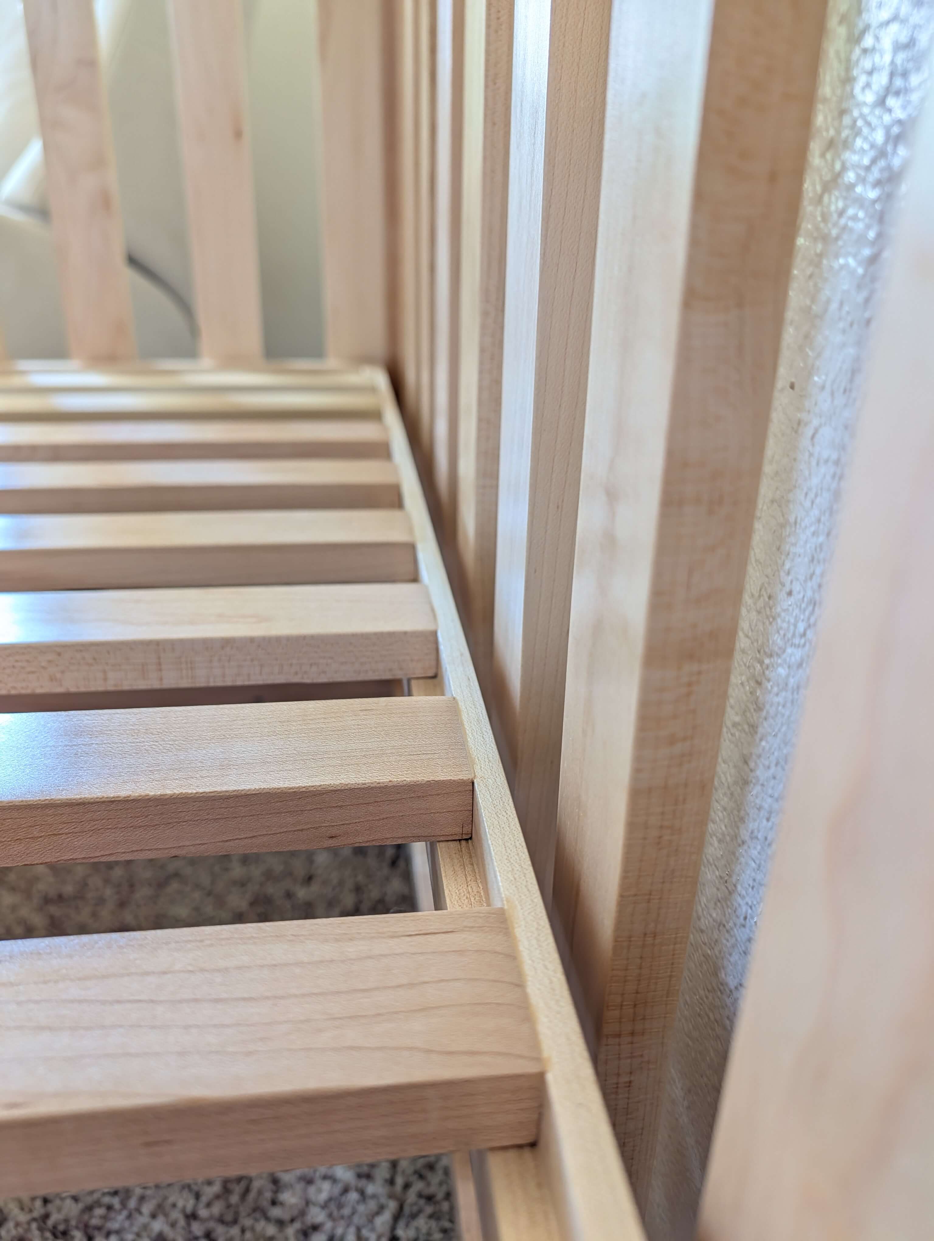 Hard maple crib showing sturdy mattress support