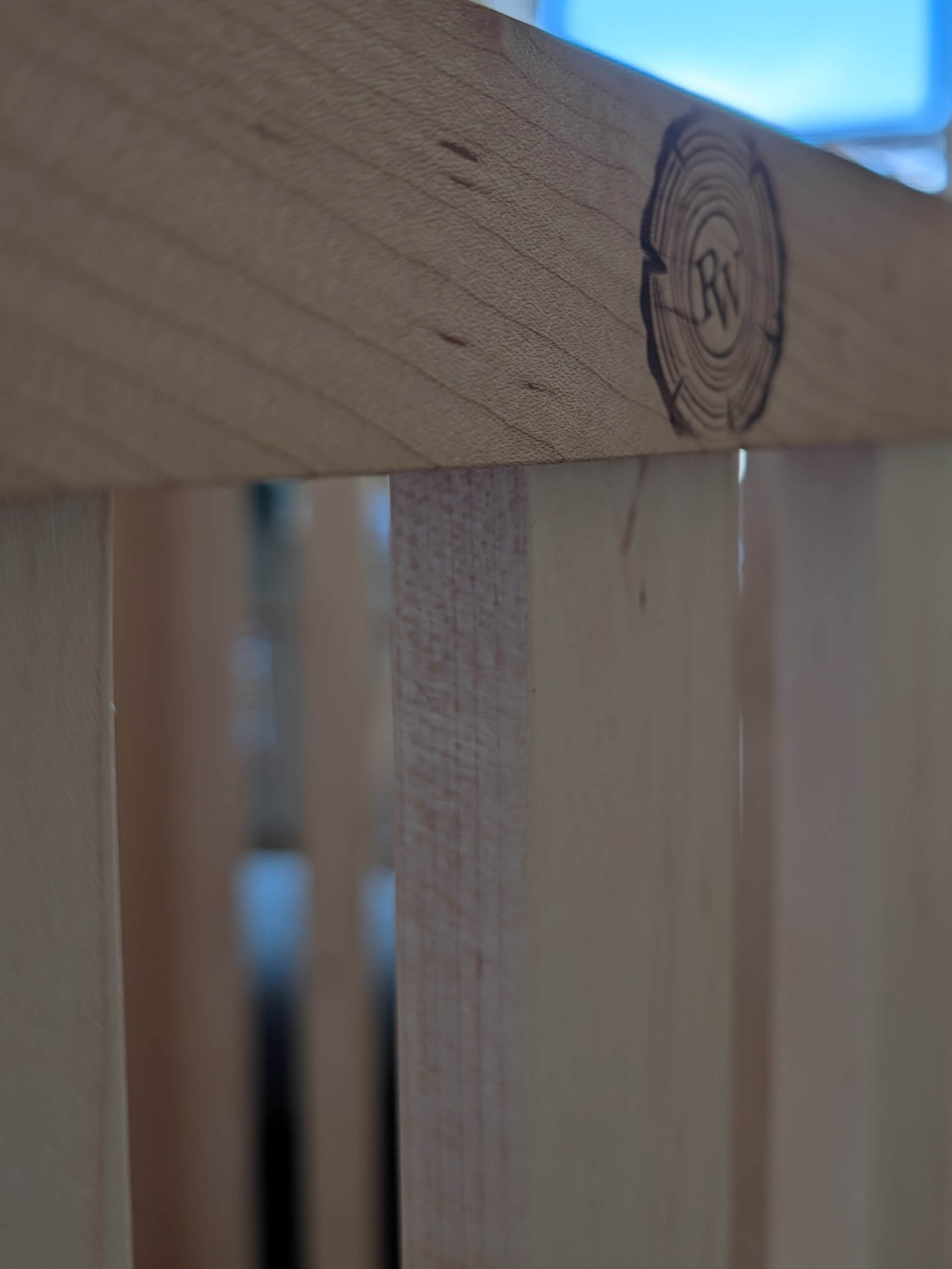 Woodworking detail of a custom crib rail
